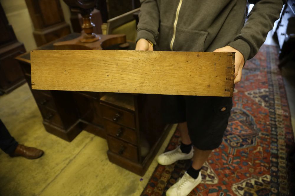 A George IV mahogany kneehole desk, with recessed cupboard, W.115cm, D.60cm, H.76cm